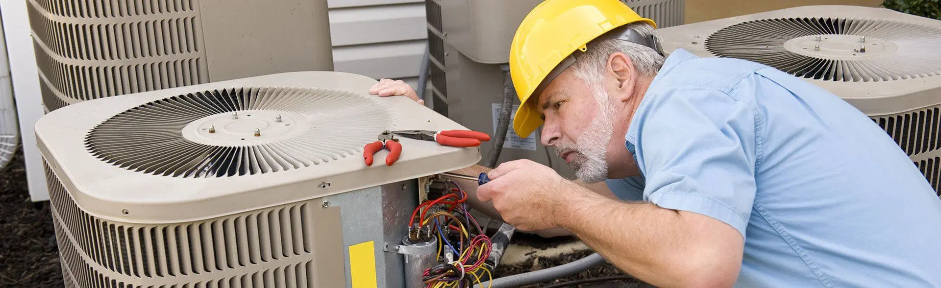 A man fixing a fan